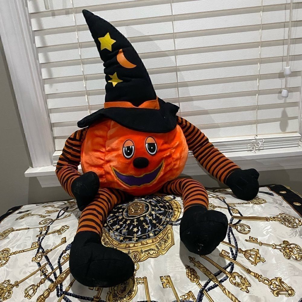 Vintage Pumpkin Man with Velcro clasping limbs. Limbs can dangle or be posed.